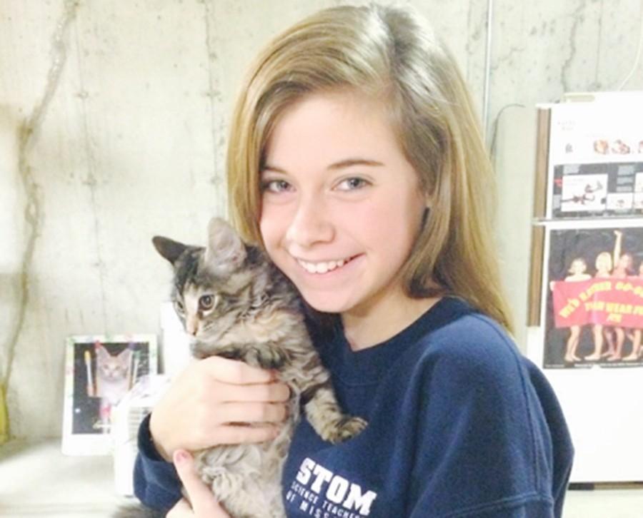 Freshman Kennedy Silverberg holds her cat Pixie. 