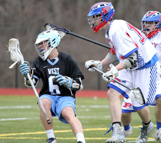 Senior Kyle Bernstein shakes off a defender against Priory on March 25. 