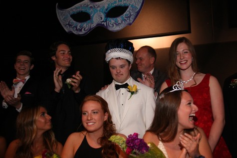 Senior Jack Griffin stands in front of the Prom attendees after receiving his crown as co-Prom King.
