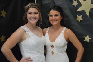 Seniors Kaitlyn Lawler and Natalia Everett pose for pictures  before the show.