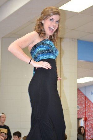 Freshman Kennedy Silverberg smiles as she poses at the end of the runway.