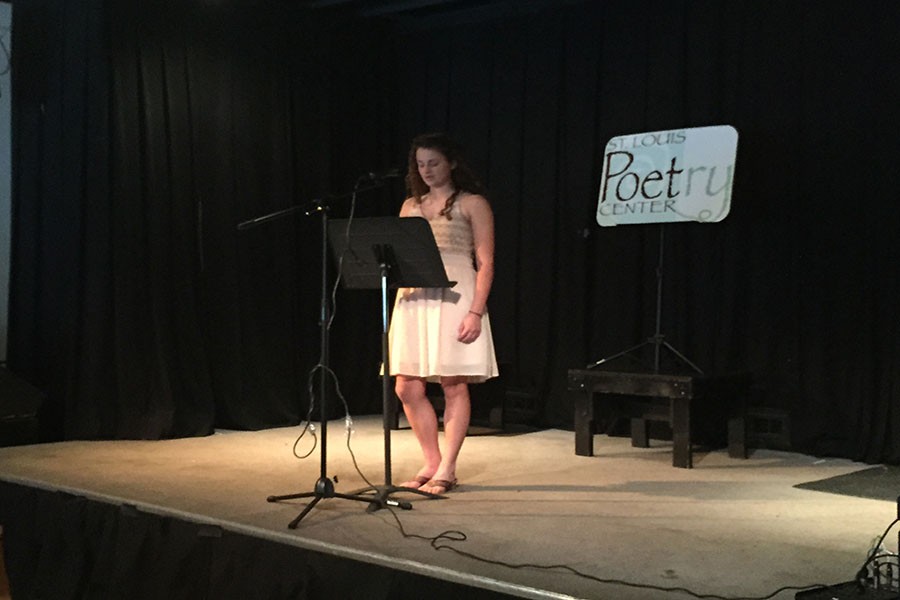 Attending the Beverly Hopkins Poetry reading, sophomore Rachel Griffard reads her poem Chains to the audience.