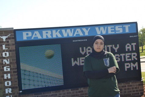 Junior Sarah Hima stands in front of West’s welcome sign. “I’m not sure why we weren’t on the Post-Dispatch list initially,” Hima said. “We’re a hardworking school, and I feel like we should have earned a place.”