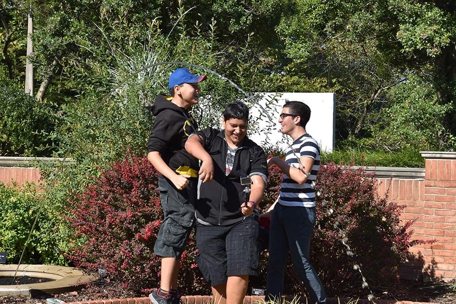 Filming with a GoPro, Prepa Tec Students Luis Roberto, Guillermo Esparza and Max Villarreal jump into the fountain, trying to get water on each other.