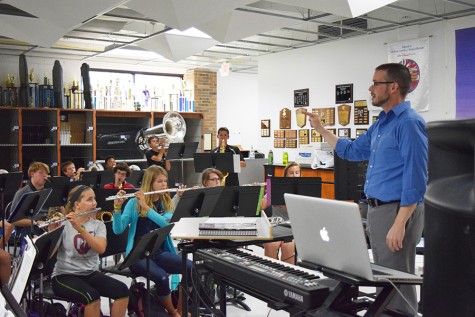 Mr. Wallace conducts the Parkway West High Marching Band in preparation for a Friday night football game.