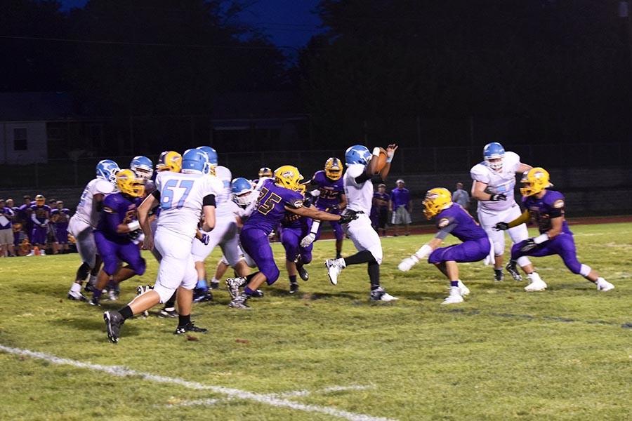 Senior running back Nick Lewis sheds off a defender on the way to upsetting the number five ranked Affton Cougars. 