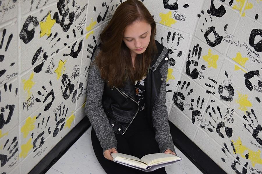 Freshman Rebecca Gibson reads Thirteen Reasons Why in study hall.