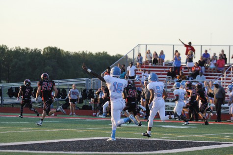 Junior Antonio Smith and Senior Simon Lindo celebrate senior Bobby Connors pass completion for a big gain.