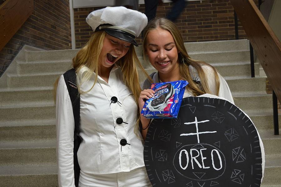 Seniors+Audrey+Frost+and+Anna+Worpvik+participate+in+homecoming+week+by+dressing+up+as+the+cookie+and+the+baker.+