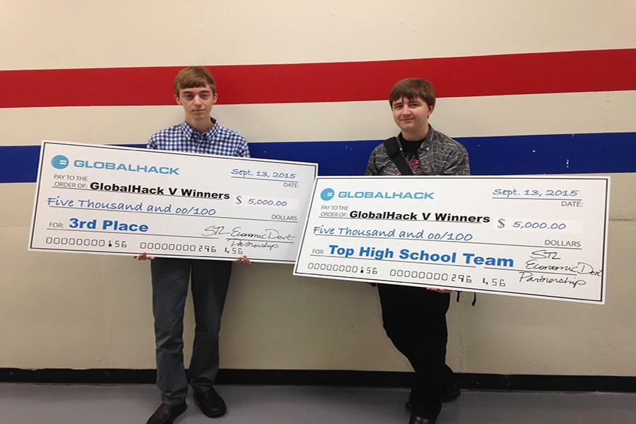 Seniors Samuel Wait and Matt Sauer hold their oversized $5,000 checks from Globalhack V.