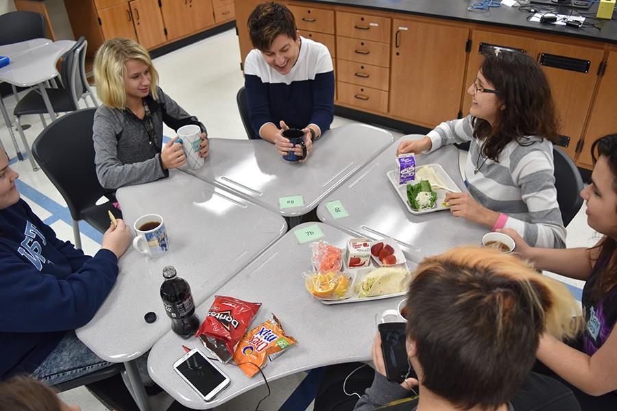 Students at the Tea Time meeting for first lunch discuss the new Star Wars movie coming out with science teacher and creator of the holiday, Amy Van Matre-Woodward.