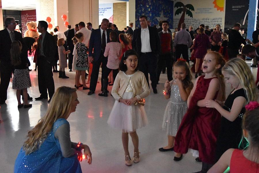 Meeting fans, senior Audrey Frost dressed up as Disney princess Elsa for the elementary school girls.  She was one of two seniors, along with Olivia Molina, who dressed up as a princess. “I loved portraying a figure that so many young girls adored, and getting the chance to dance brought so much joy to me and everyone else there,” Frost said.