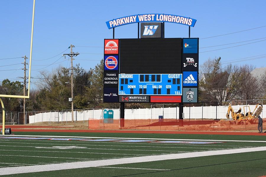 The new scoreboard is adorned with advertisements to pay for the $400,000 scoreboard.