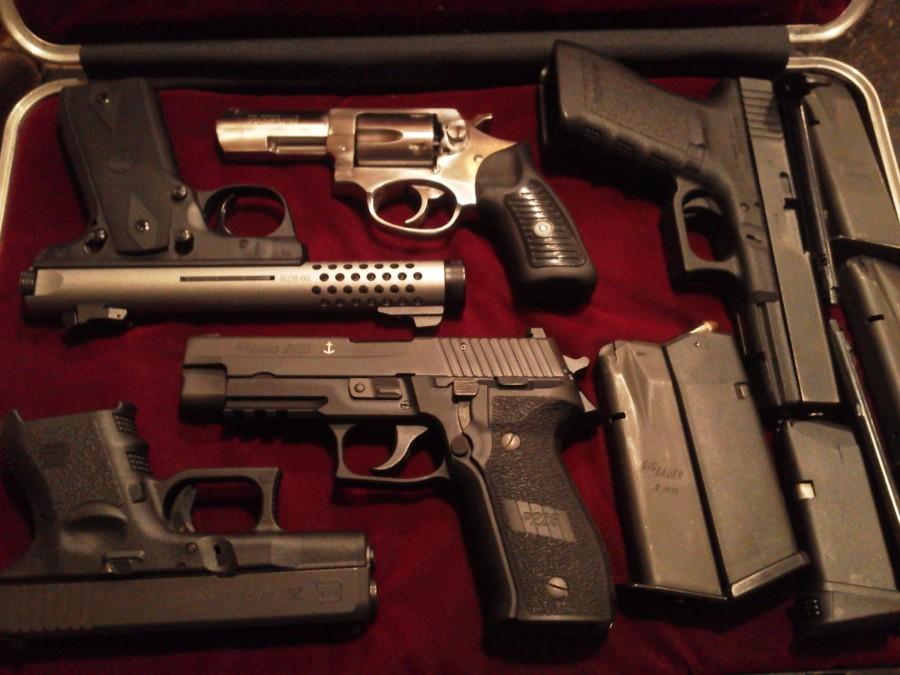 National+Guard+Member+Patrick+Berry+displays+his+gun+collection.