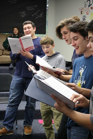 Jazz Choir students senior Omar Deiab, junior Alex Dunn, and seniors Jacob Cupps, Connor Gately and Alex Hubbard prepare for the upcoming Coffee House.