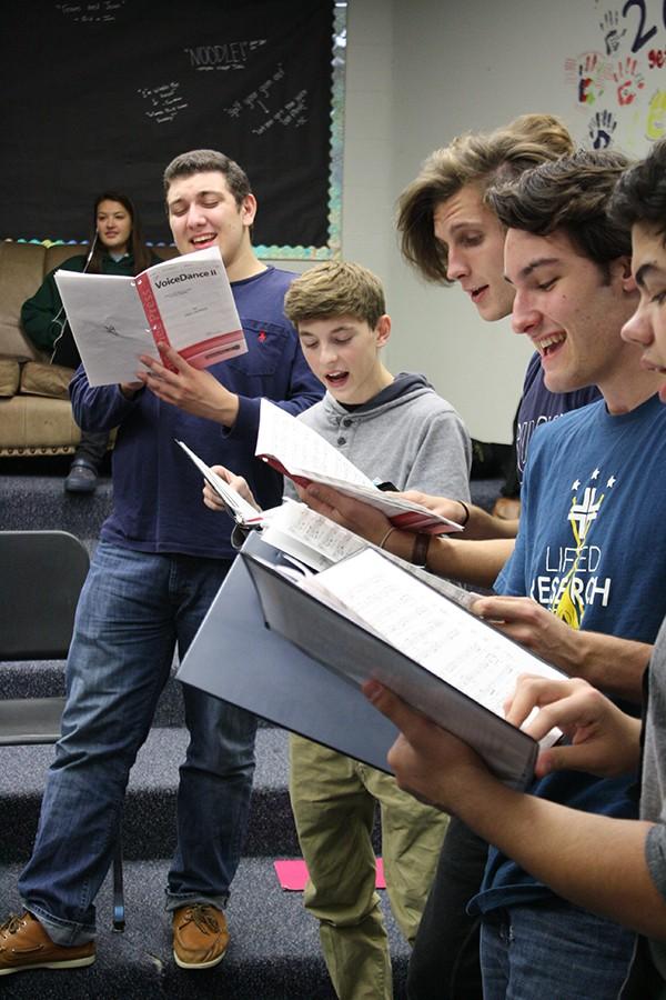 Jazz Choir students  senior Omar Deiab, junior Alex Dunn, and seniors Jacob Cupps, Connor Gately and Alex Hubbard prepare for the upcoming Coffee House.