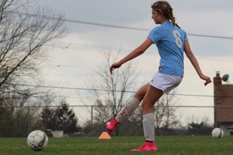 Settling the ball, Ashton Manwill completes the pass.