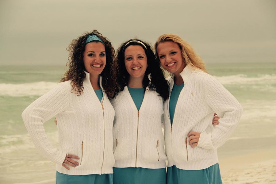 B. Kottmeyer poses with her two triplet sisters.  On most days though my sisters and I are really close. They are kind of built in best friends and there for safety. You are almost never bored and you almost never are alone, she said.