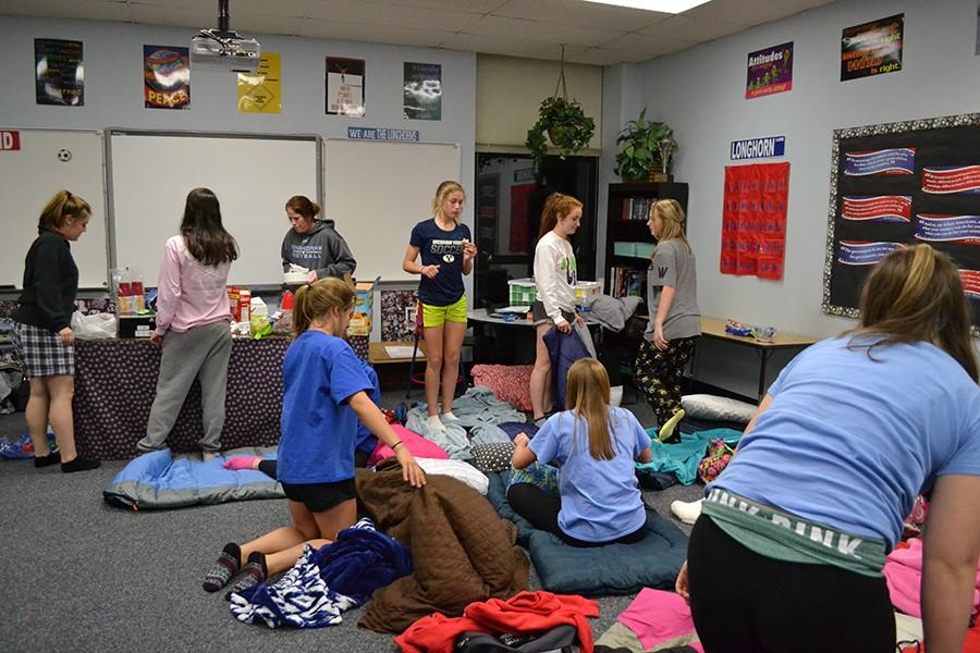 Every year before the season begins, the girls varsity soccer team spends the night in head coach Annie Waylands room as a way to bond before the games start. 