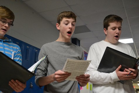 Tenor twos senior Marc Doughter, juniors Alex Dunn and Josh Gorman practice an arrangement of the traditional tavern song Blow The Candles Out in a sectional reherasal.