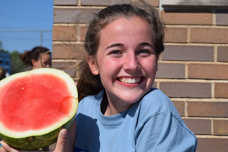 Holding+up+her+watermelon%2C+Managing+Editor+in+Chief+Betsy+Wait+prepares+to+dig+in.+