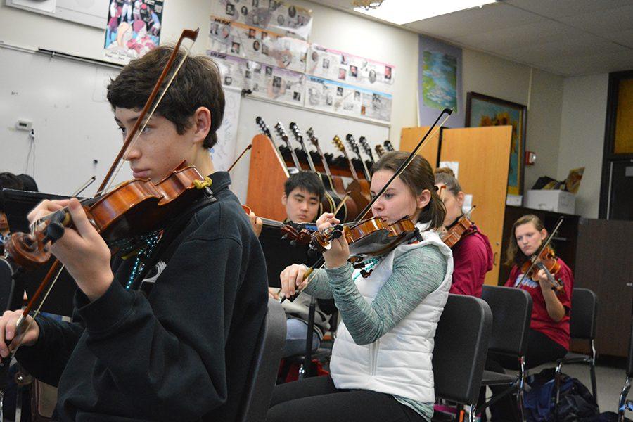 Symphonic Orchestra students rehearse during class.