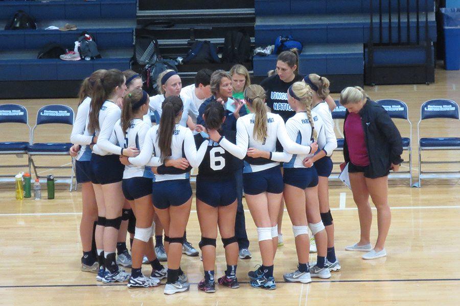 During a time out, Coach Susan Dean points out the strengths and areas for opportunity during the game.  "Even when she doesn't call the time out, she uses it to make us better with every word she says," junior Maddie Schoessel said.