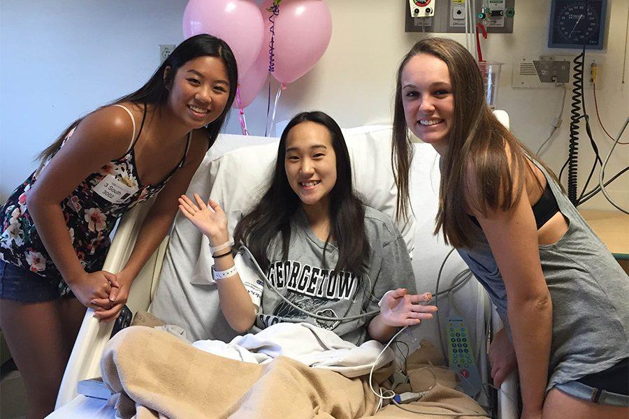 During her treatment for FSG, senior Jenny Chai is visited by friends seniors Annie Doig and Claire Pellegrino at Cardinal Glennon Hospital.