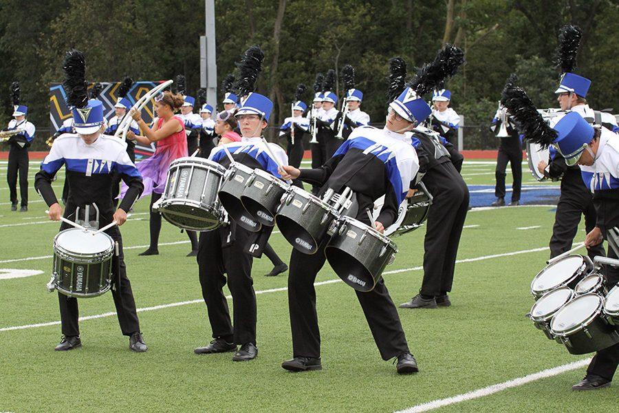 The drum line does a visual feature during the third movement of their show at a competition in Washington, MO. on Saturday Oct. 1.