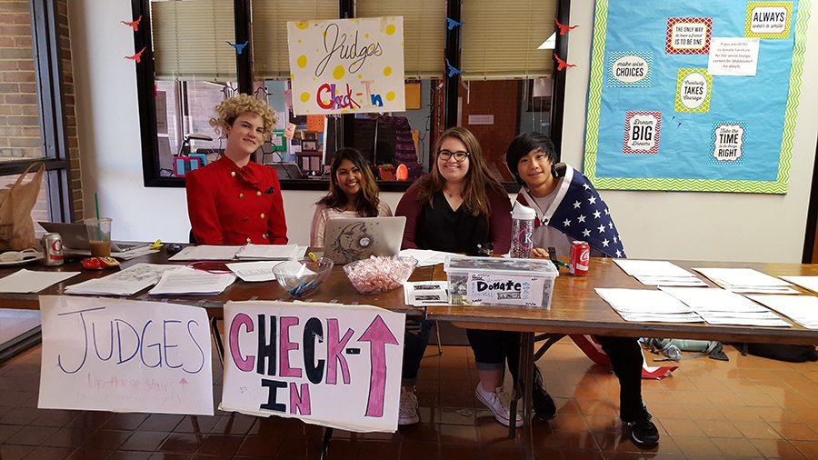 Checking in judges, senior Jessie Calvert, junior Nadira Shabbir,  sophomore Kristina Humphrey and freshman Jon Ma prepare for the Parkway West Invitational debate tournament. 