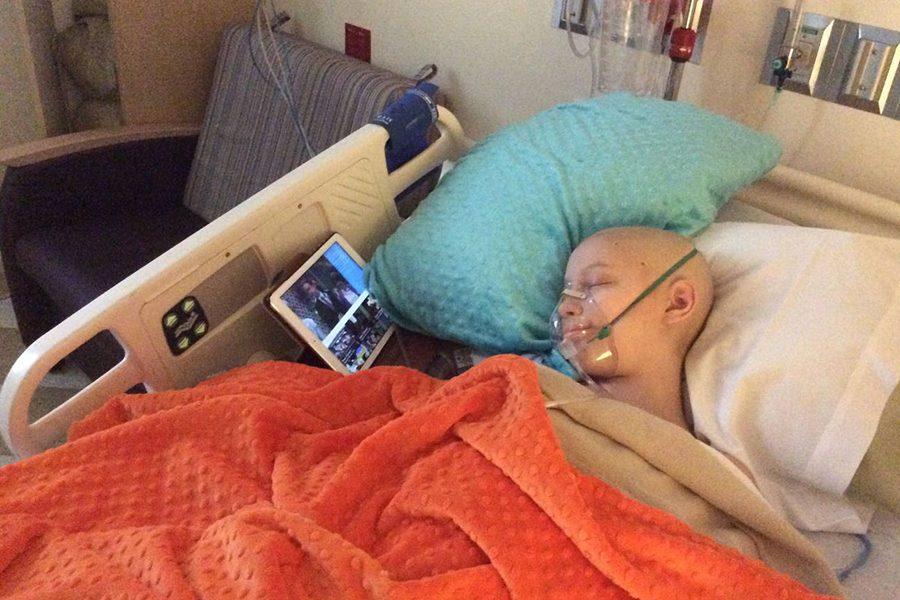 Brynn Haun sleeps after her rib surgery halfway through her cancer treatment.