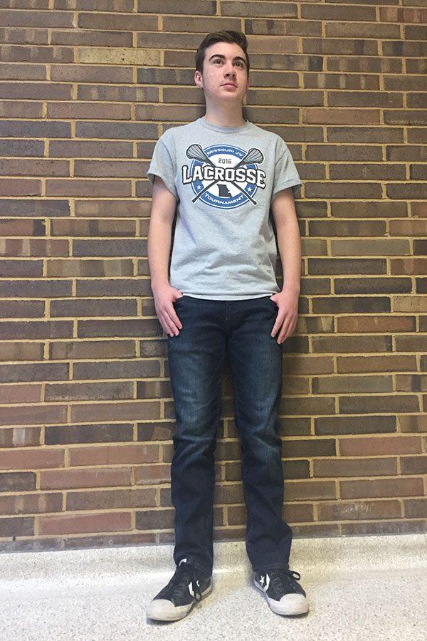 Sophomore Alex Schumert poses in a lacrosse shirt he printed himself.