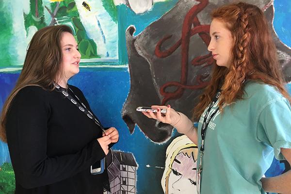 During the week before Thanksgiving, freshmen  Megan Kixmille and Carly Andersen practice with the StoryCorps app in preparation for interviewing their loved ones.