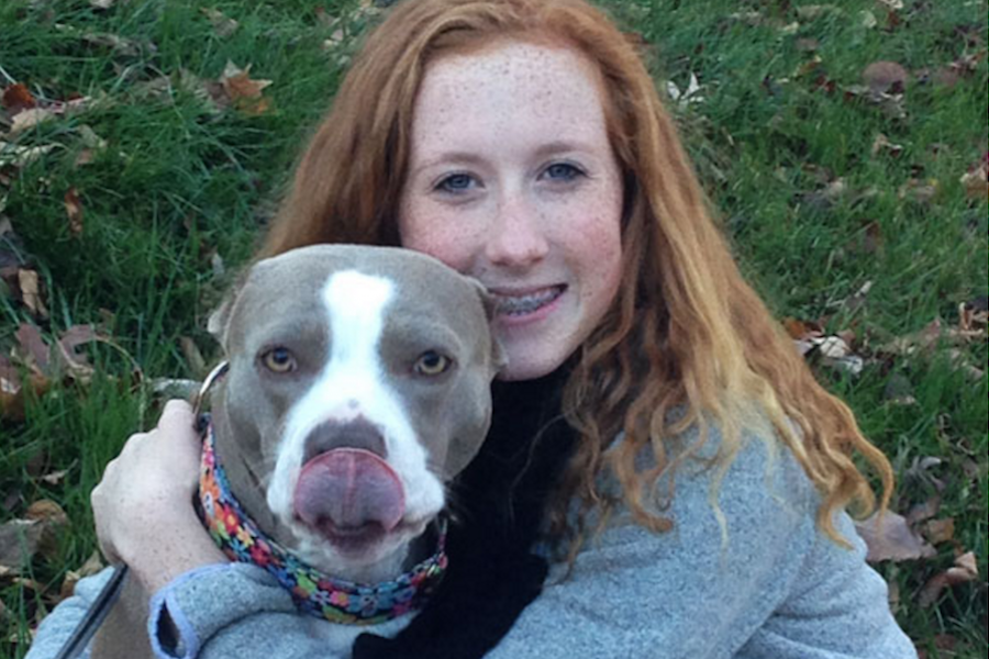 Junior Sydney Veltman poses with her dog, Carlee, in the photo that was submitted to the Petco contest.