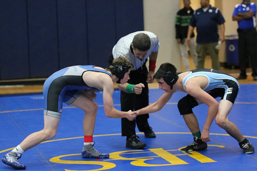 Sophomore+Noah+Wright+shakes+hands+with+his+opponent+before+wrestling+at+John+Burroughs+High+School+on+Dec.+2.