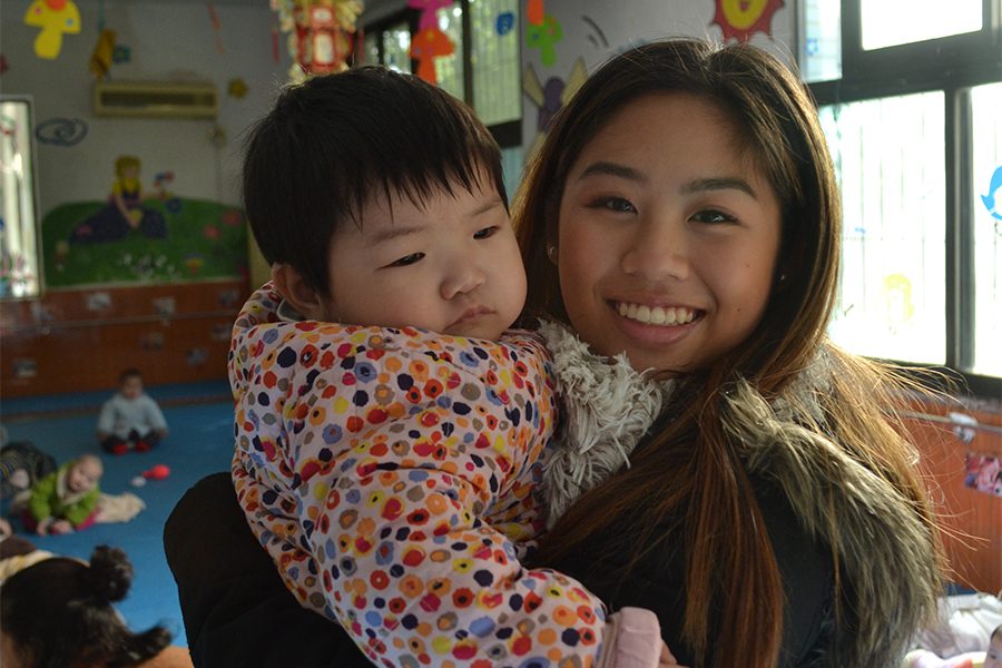 Annie holds a child from the Nanchang orphanage she used to live in.