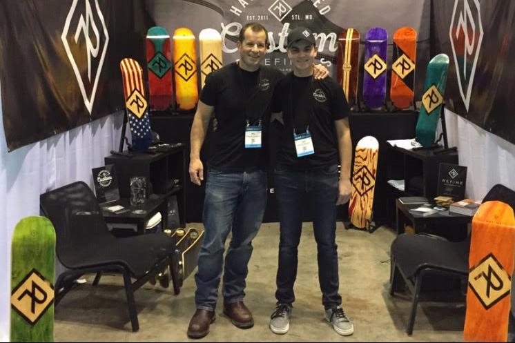 Cody Corbin and his father, Mike Corbin, stand at their booth at the Surf Expo in Orlando, FL.