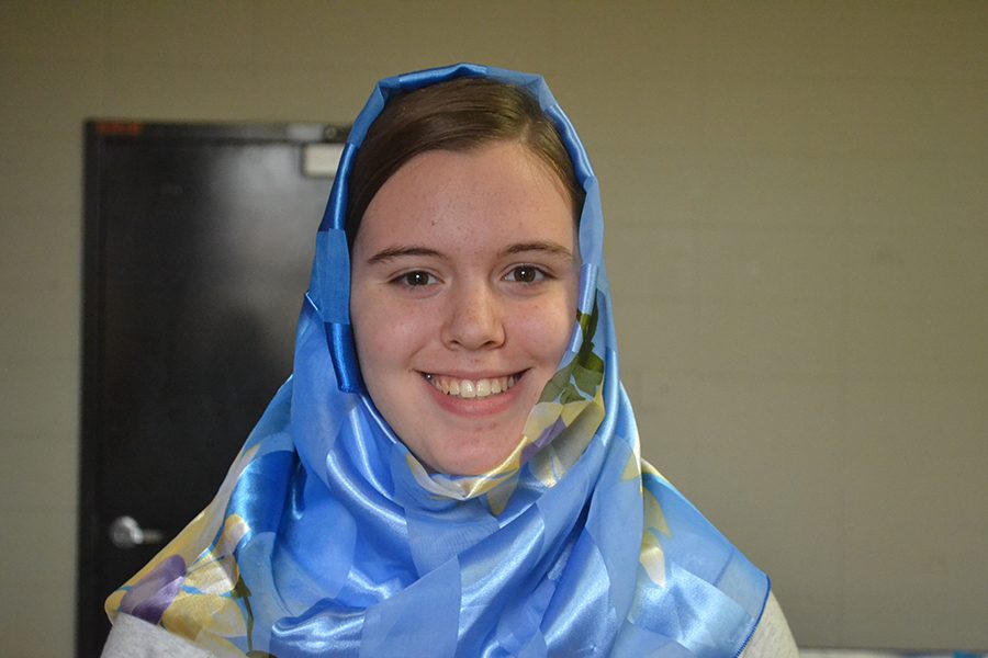 Wearing a blue headscarf, junior Sydney Kinzy stands up for equality. The 2017 celebration was the fifth annual World Hijab Day.