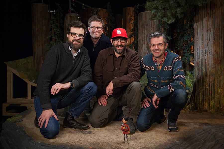 Brad Schiff, sporting a red St. Louis Cardinals hat, poses beside his team and Kubo, the title character of the movie. "The look main look of the film is inspired by the Japanese woodblock prints of Kiyoshi Saito. Kiyoshi Saito was the key stylistic influence that was the unifying design element throughout the entire movie."