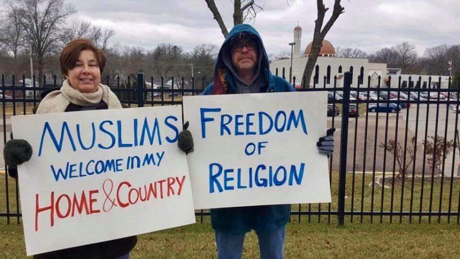 Michele Mordica, an art teacher at Parkway Central Middle, and her husband stand in solidarity with the local Muslim community at the Daar-Ui-Islam Masjid.