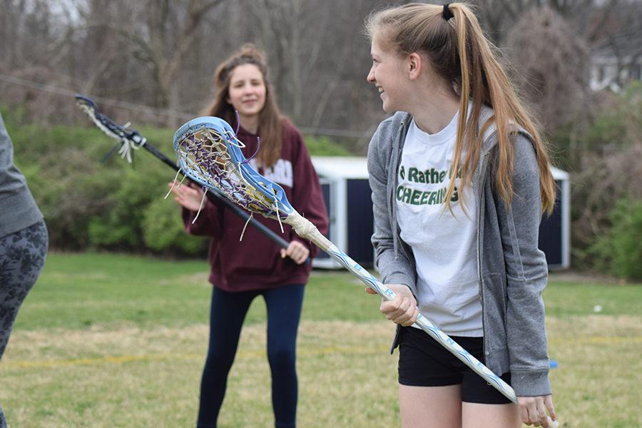 During C-team practice, freshman Ava Pfeil checks to see if anyone is open.