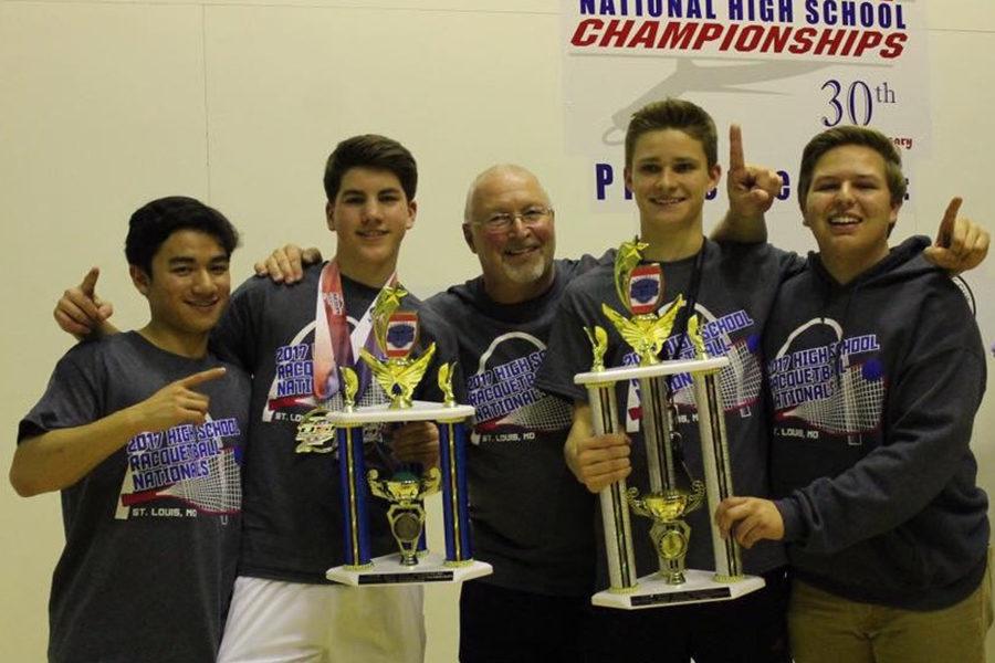 Seniors Tommy Avanzado, Carson Smith, Andrew Deadwyler and Will Meyer hold up their National Championship trophies with their coach Mike Williams.
