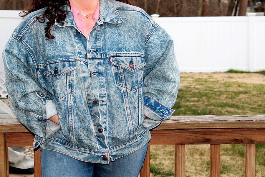 Young cute woman in a denim jacket and with a backpack posing on a white  background 6589927 Stock Photo at Vecteezy