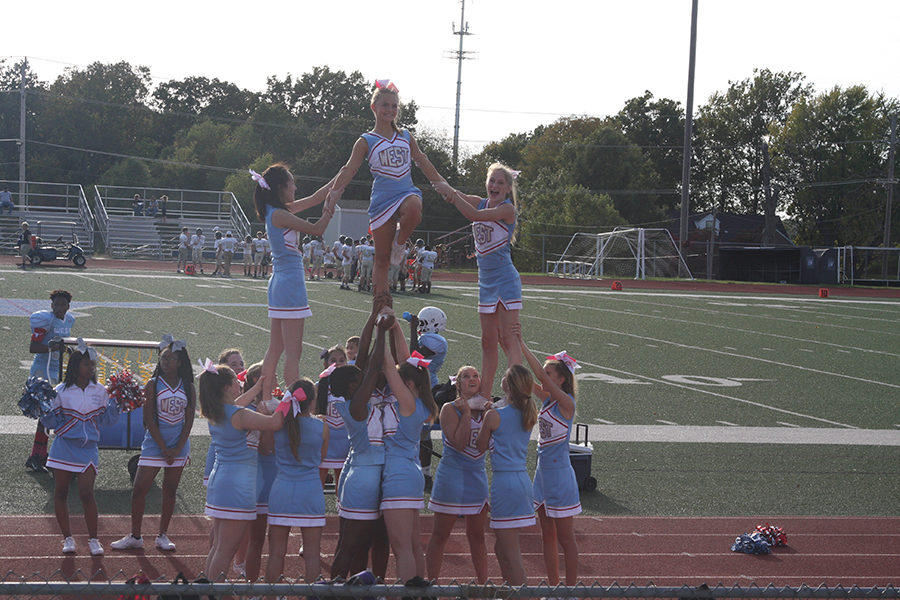 Freshman JV and varsity cheerleaders cheer for the freshman football team at their last game of the season. 