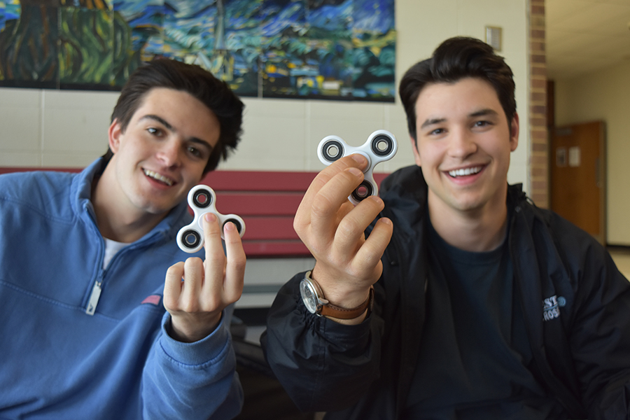 Juniors Blake Geraghty and Christian Hollingsworth show off their fidget spinners.