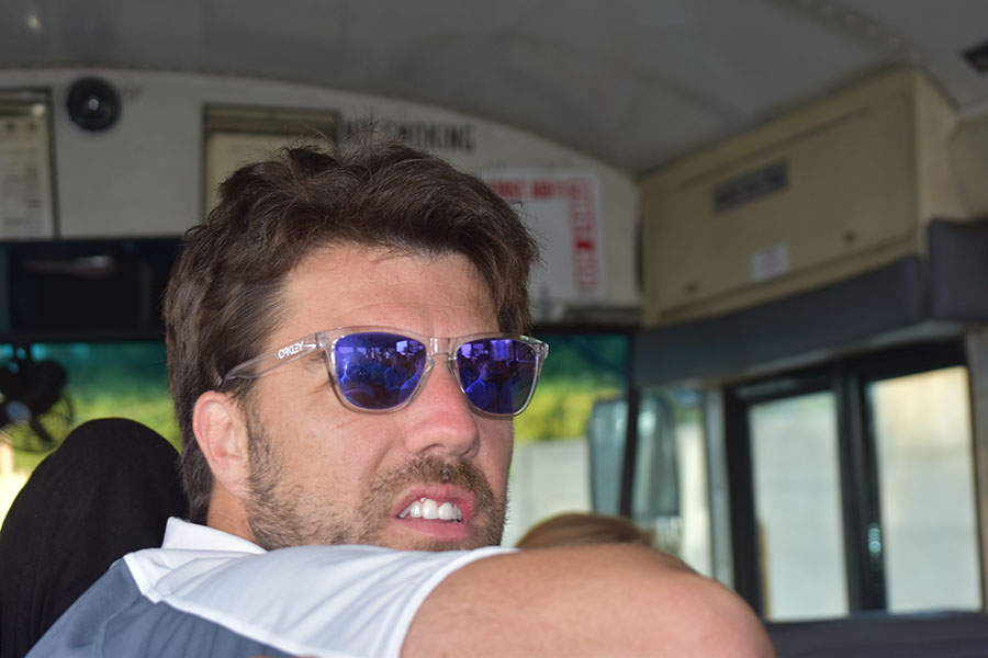 Girls cross country captain Charlie Cutelli styles his iconic Ray-Ban sunglasses on the bus on the way to the Stan Nelson Invitational Sept. 9. 