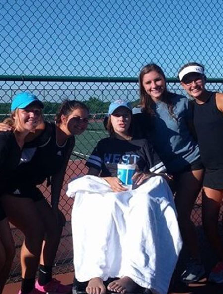 Attending the girls tennis match on Aug. 22, Brynn poses with her teammates sophomore Samantha Peterson, sophomore Kelly Wehrmeister, sophomore Natalie Hithcock and freshman Sara Frautschi.