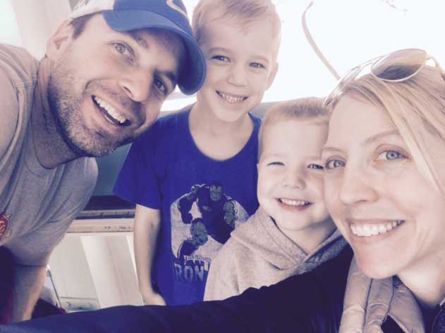 Weber poses with her husband, Ryan, her six-year old son, Michael and her four-year old son, Braden at the St. Louis Science Center.