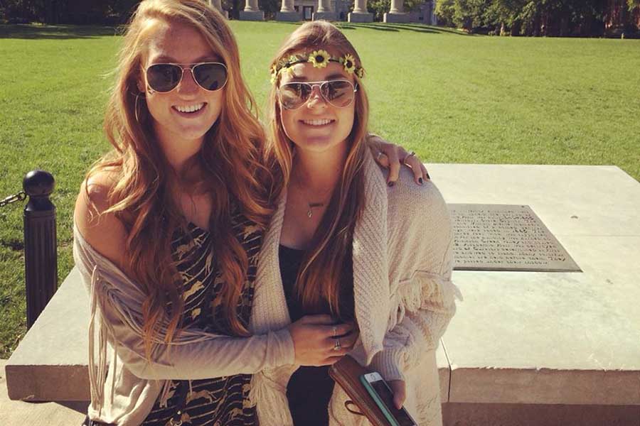 Rose poses with her sister, alumna Maddie Rose in front of the Mizzou columns. Both of the Rose sisters attended Mizzou.