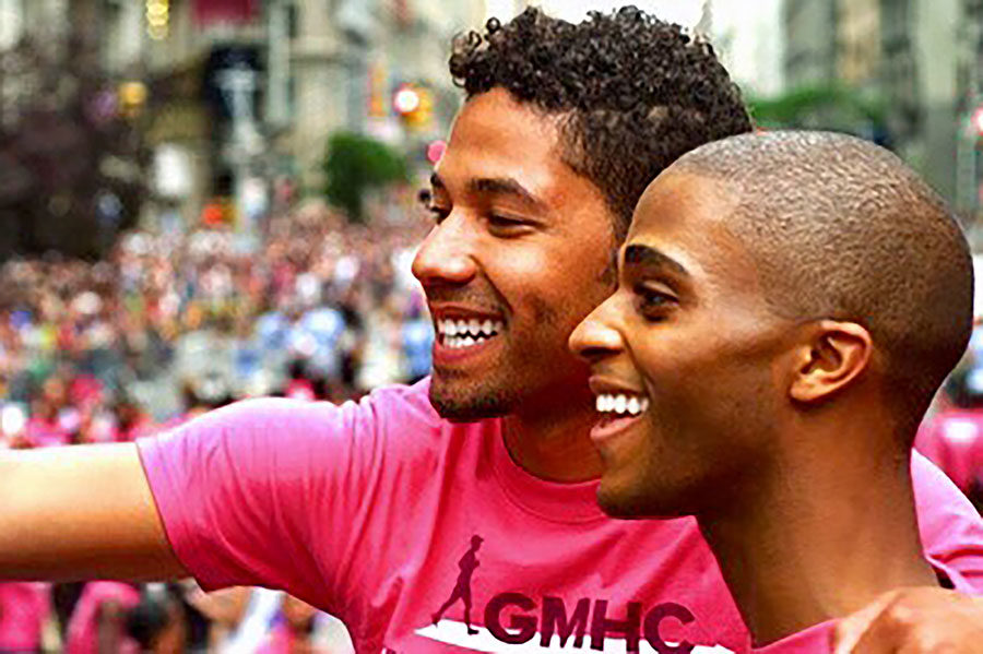 Actors Jussie Smollett, from Empire, and Blake Young-Fountain look out at a crowd during the NYC Pride Parade during the film The Skinny.